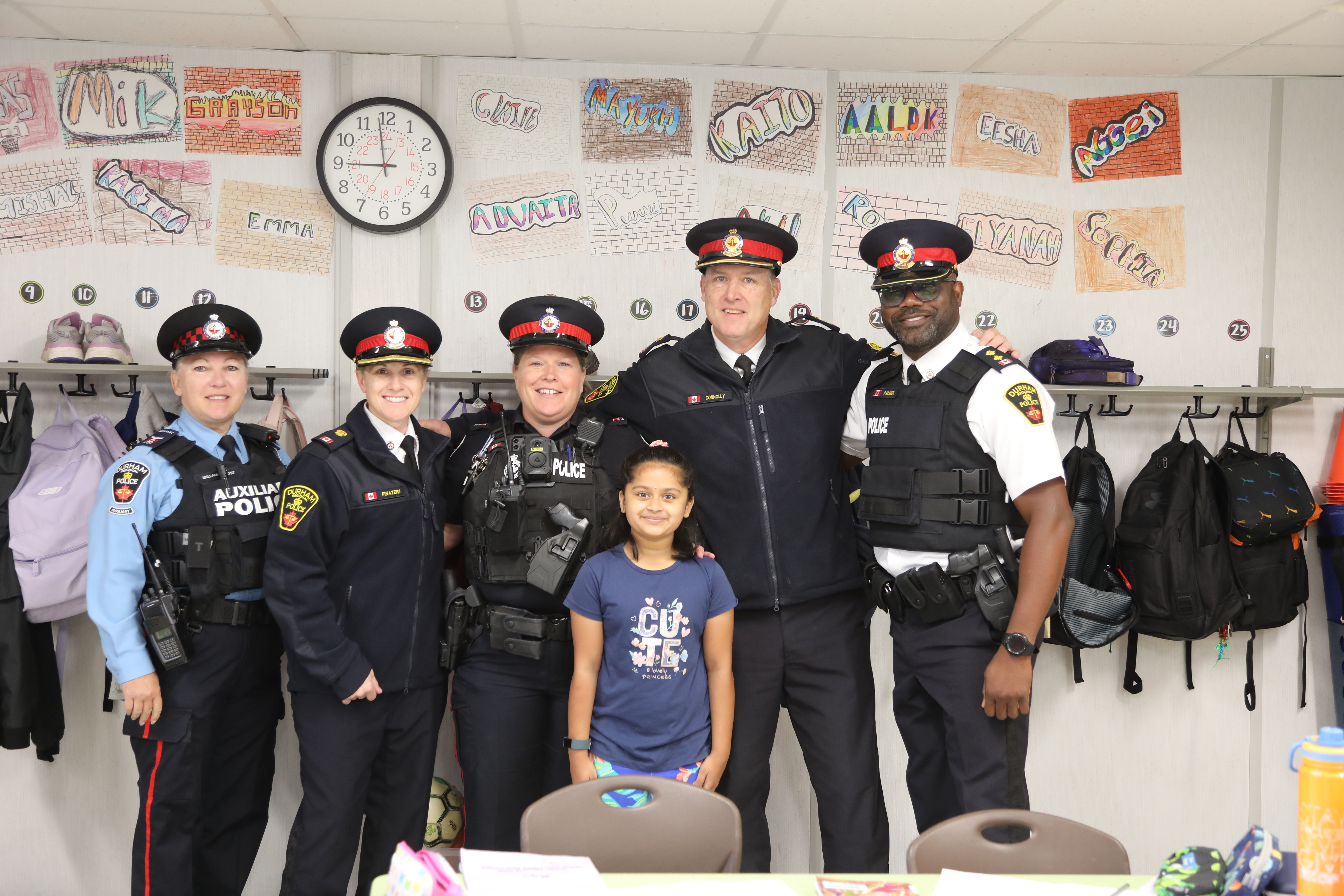 Mini Chief for a Day Winner posing with DRPS members